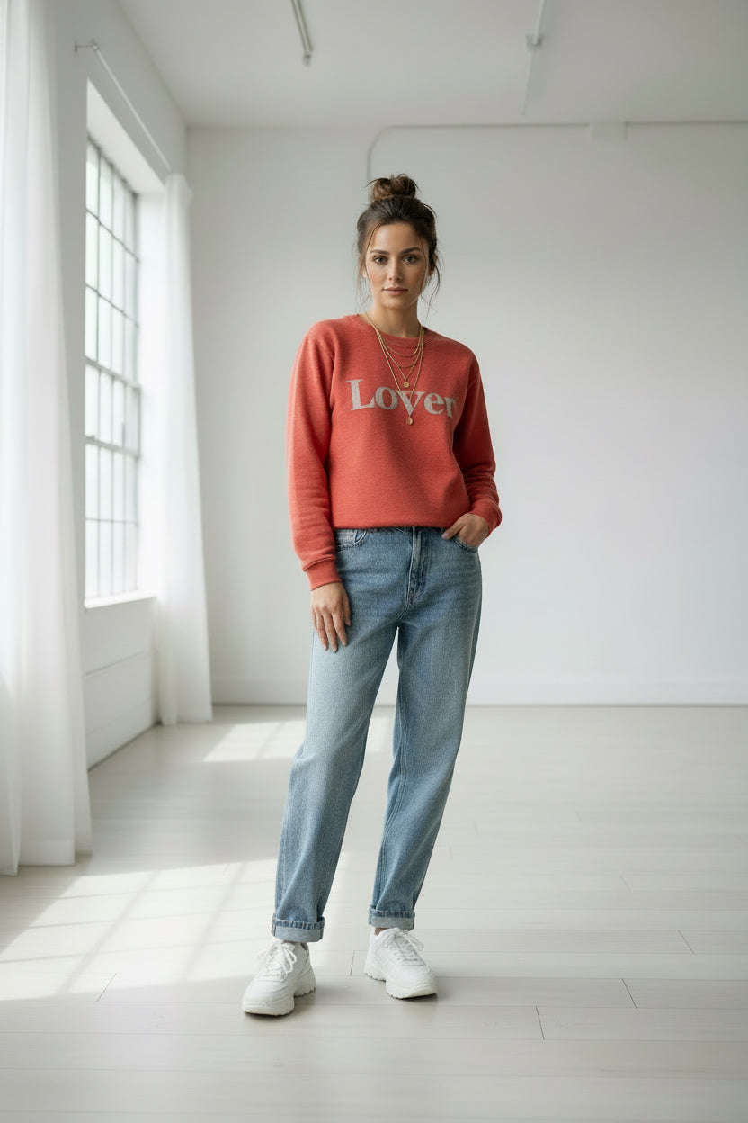 Red sweatshirt with 'Lover' text on a white background