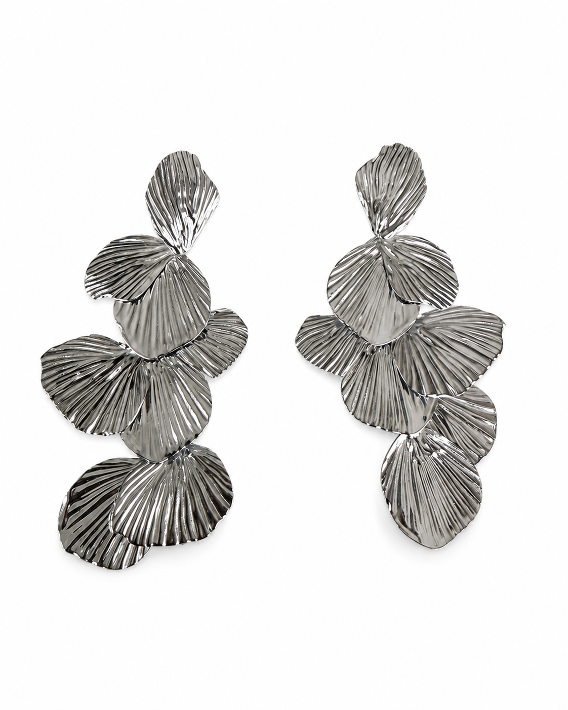 A pair of textured silver drop earrings with layered, fan-like petal shapes, displayed on a clean white background.