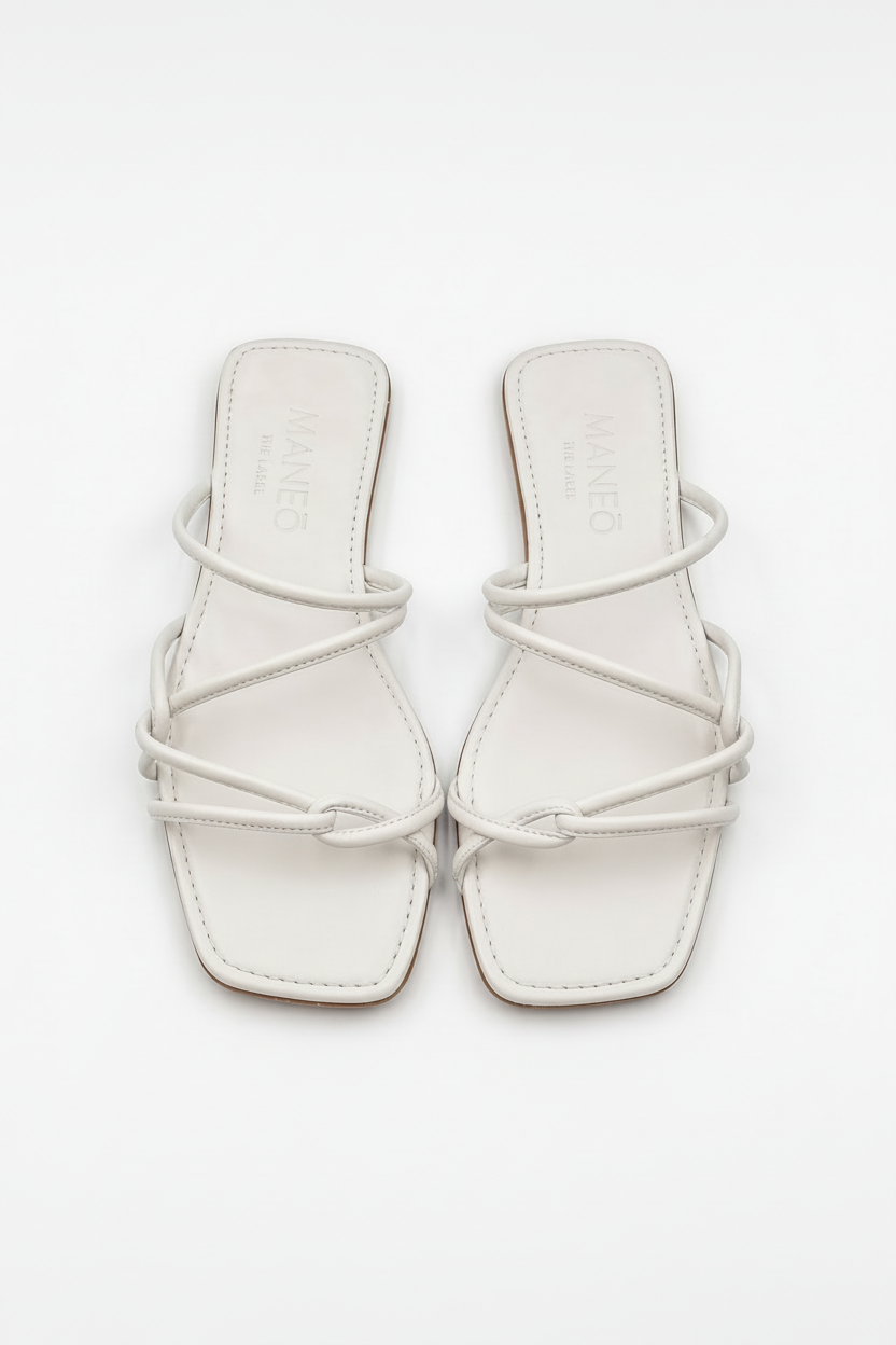White strappy sandals on a white background