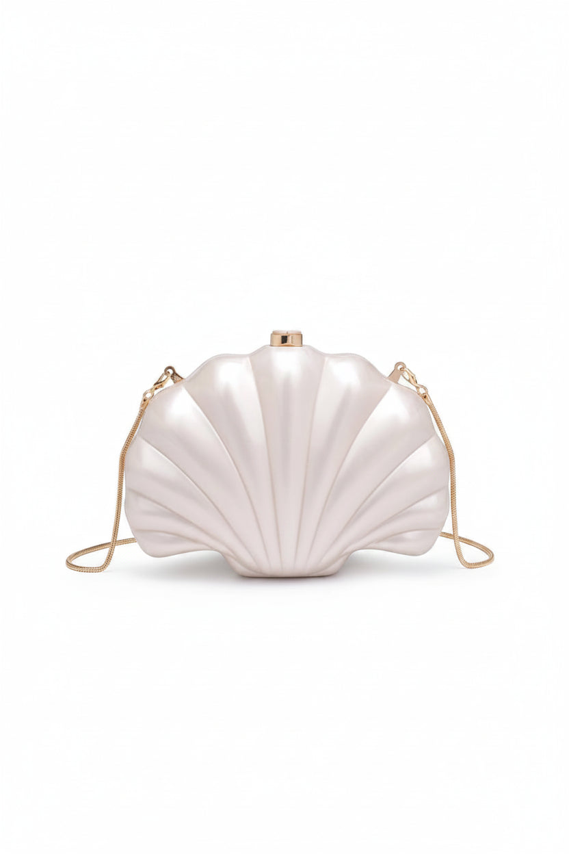 Shell-shaped handbag with a gold chain on a white background