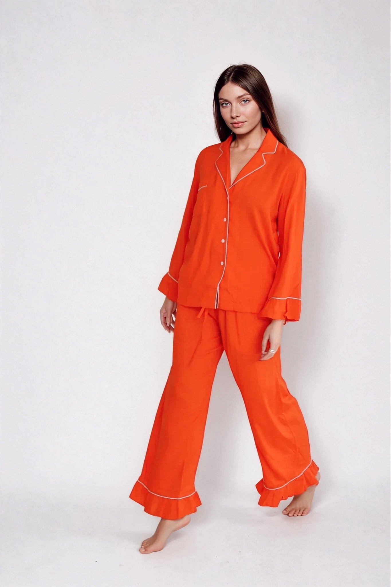 Vibrant orange and blue bamboo pajama set with contrast piping. Ethically made, ultra-soft, and designed for colorful comfort and conscious lounging.