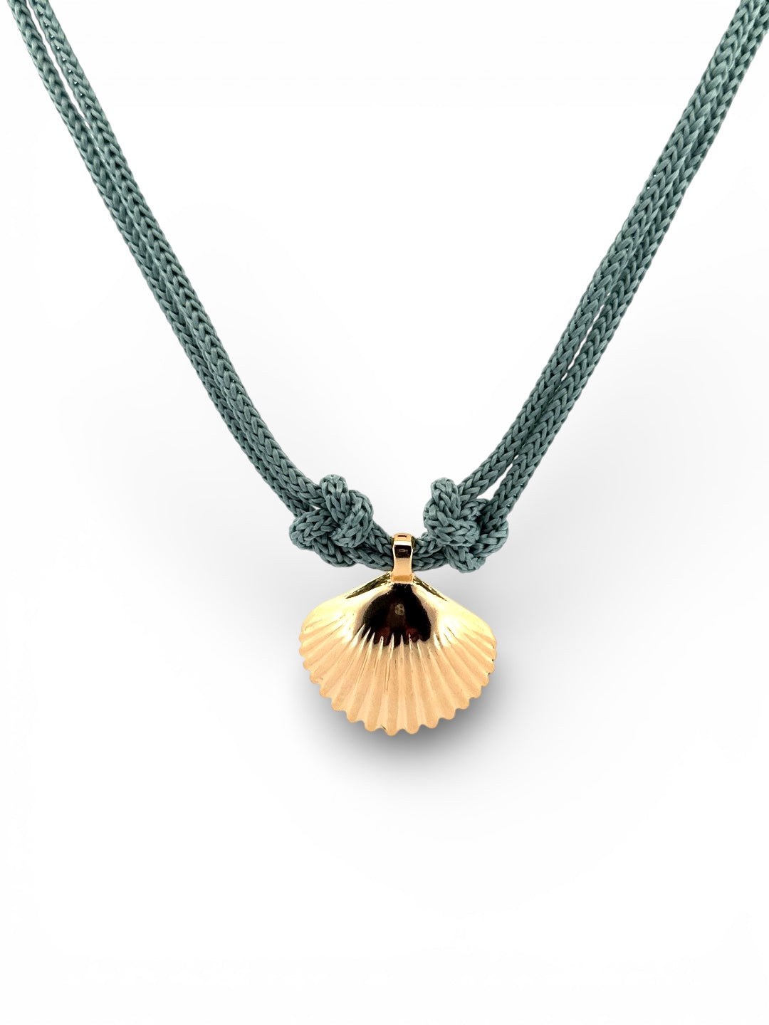 Gold shell pendant on a green rope necklace against a white background