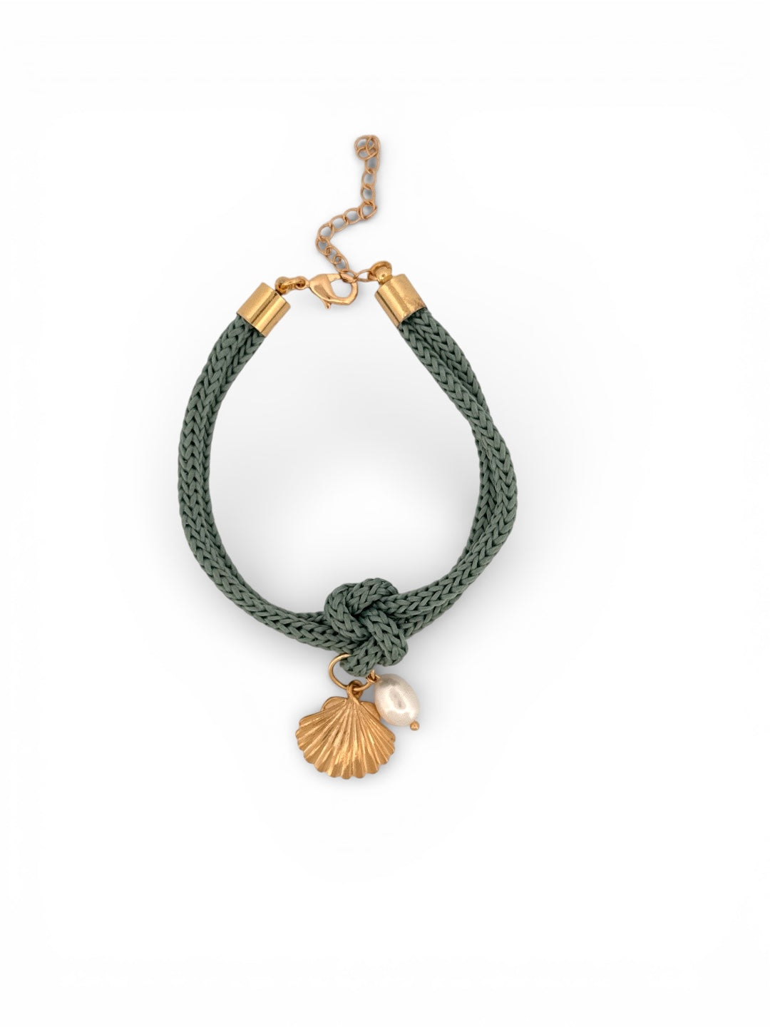Green braided bracelet with gold accents and shell charm on a white background