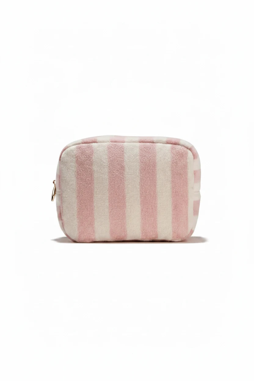 Striped pink and beige pouch on a light background