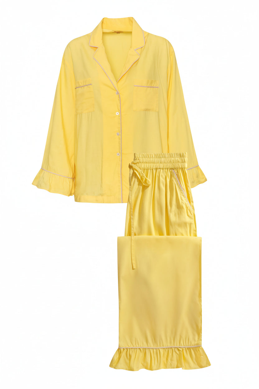 Yellow pajama set with a top and pants on a white background