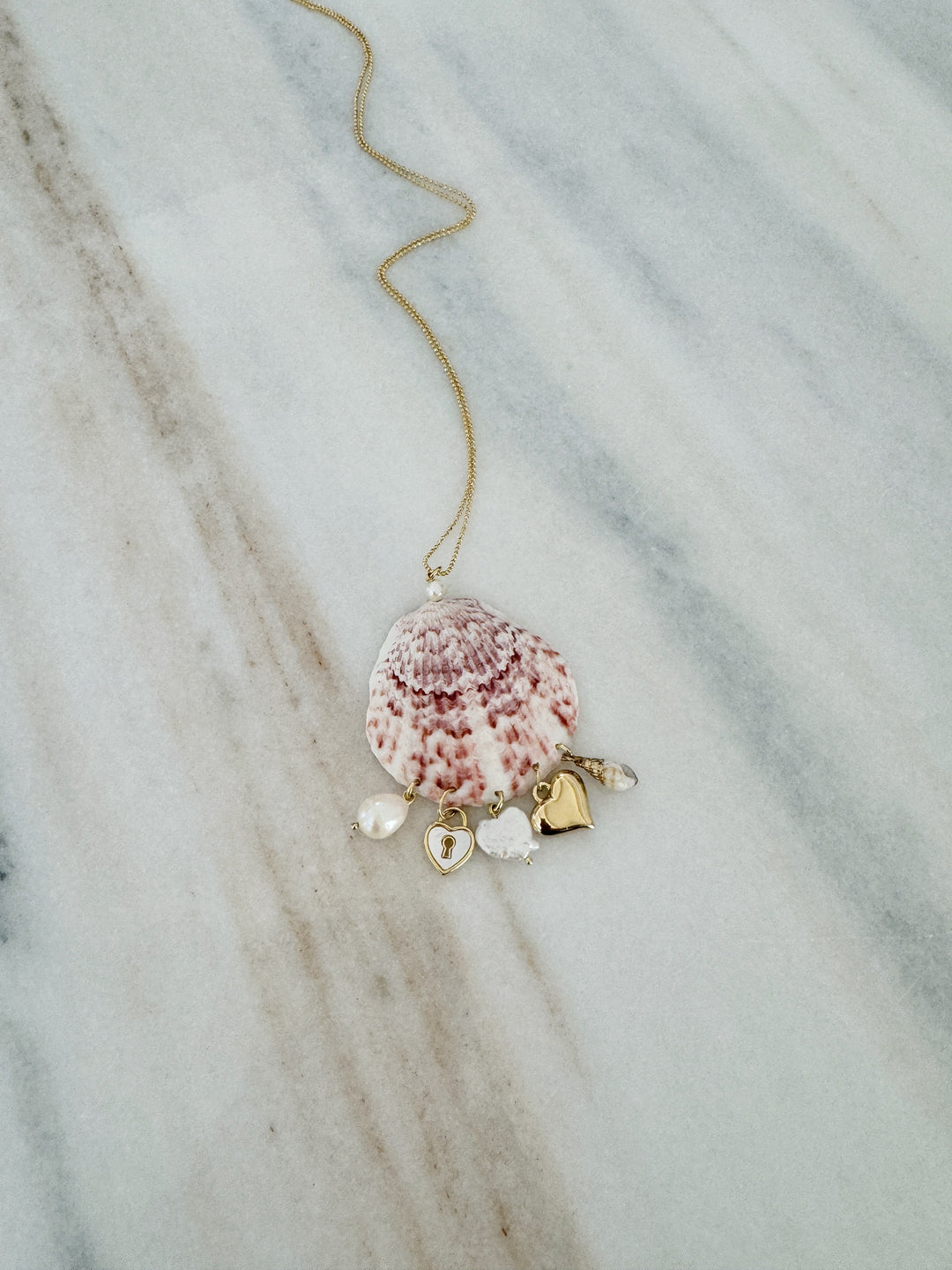 Shell necklace with gold charms