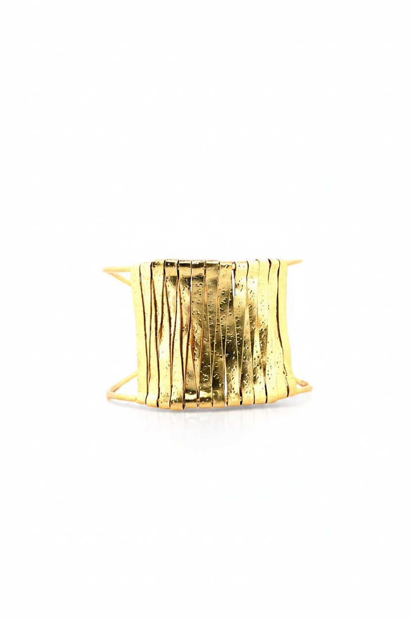 Gold bracelet on a white background